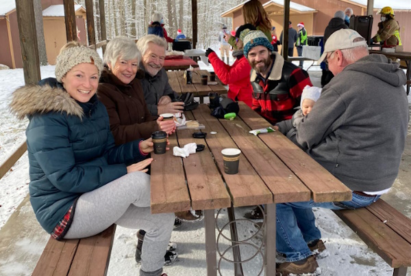 People enjoying winter meal outside