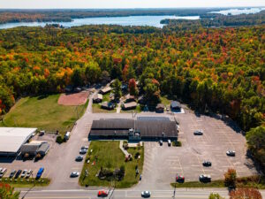 Aerial view of BCC facilities and surrounding forest and lake